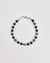 The David Bracelet in Silver laid flat, showcasing its polished silver finish, black onyx beads, and a single evil eye charm with a black CZ diamond.