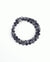 The David Wrap in Black Rhodium laid flat and wrapped, showcasing its bold matte black finish, 6mm black onyx and black labradorite quartz beads, and dual evil eye charms with black CZ diamonds.