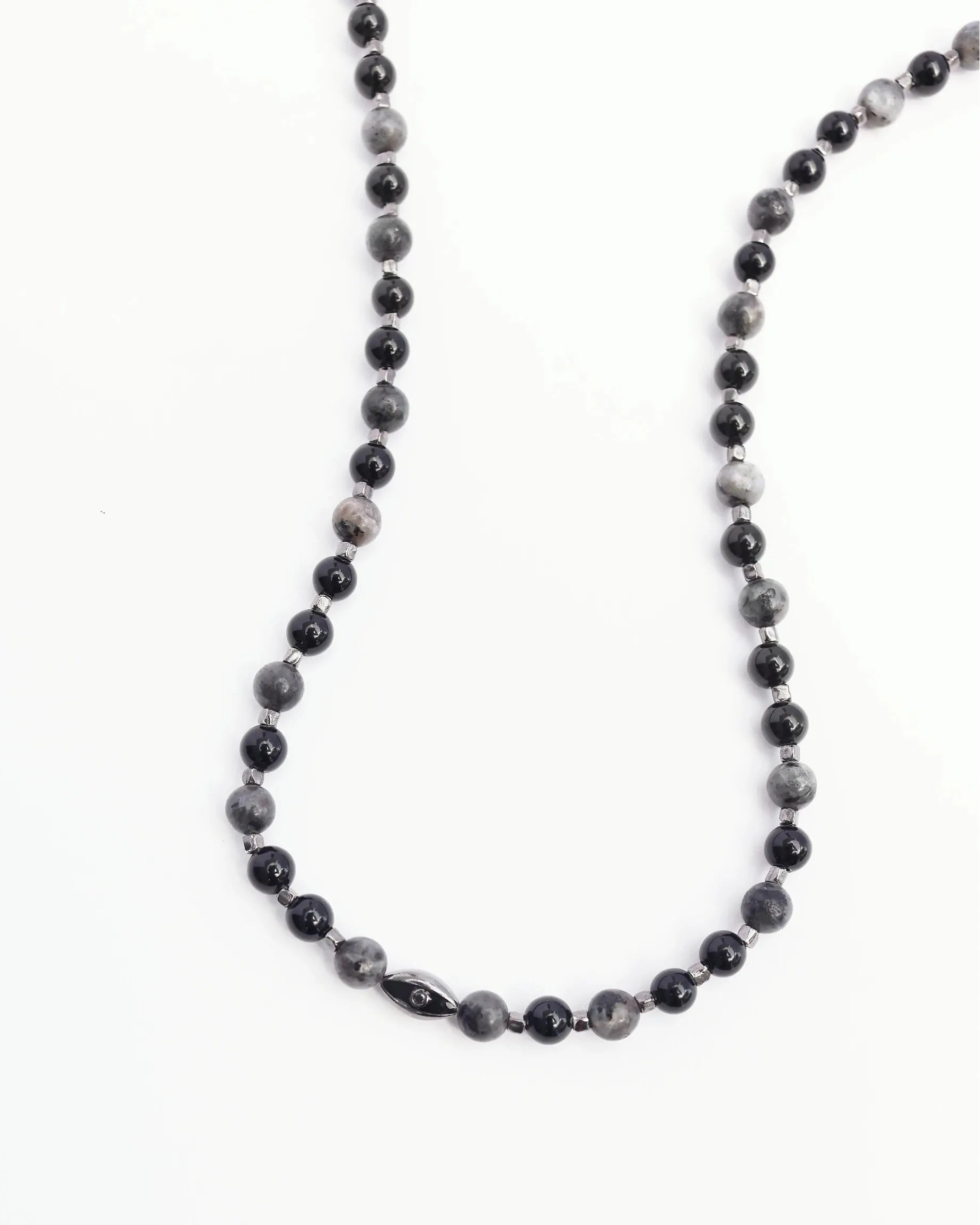 A close-up shot of the David Wrap in Black Rhodium, showing the intricate beadwork and dual evil eye charms with black CZ diamonds against a neutral background.