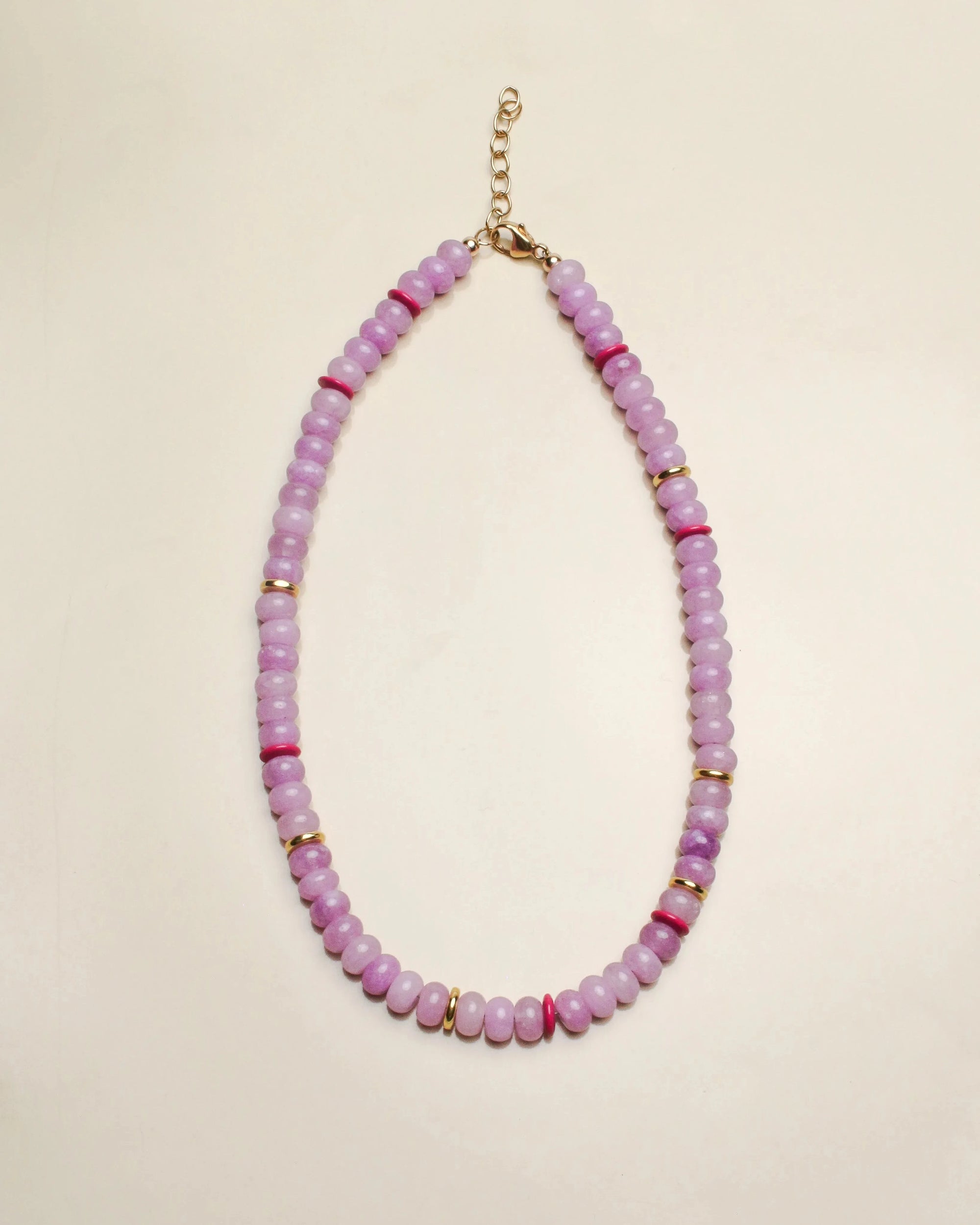 Ethan necklace in lavender displayed in a flat-lay view, featuring soft purple beads accented with pink and gold details, with a delicate chain clasp.