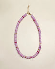 Ethan necklace in lavender displayed in a flat-lay view, featuring soft purple beads accented with pink and gold details, with a delicate chain clasp.