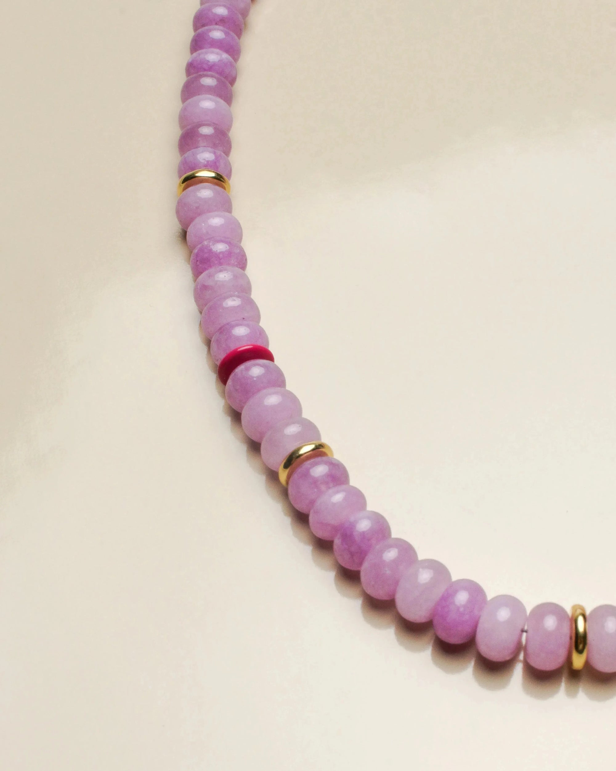 Another close-up of the Ethan lavender necklace, highlighting the soft purple beads and gold accents for a chic and elegant design.