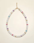 Ethan necklace in white quartz displayed in a flat-lay view, featuring milky white beads accented with multicolored dividers and gold detailing, finished with a delicate chain clasp.