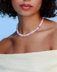 Model wearing the Ethan white quartz necklace, styled to highlight its elegant white beads and colorful dividers, adding a chic and sophisticated look.