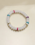 Close-up of a single Leah white bracelet from the set, emphasizing the soft white beads with colorful dividers and a striking central eye charm.