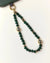 Emerald Leah  Phone Charm displayed in looped form, highlighting gemstone color and gold finishes.