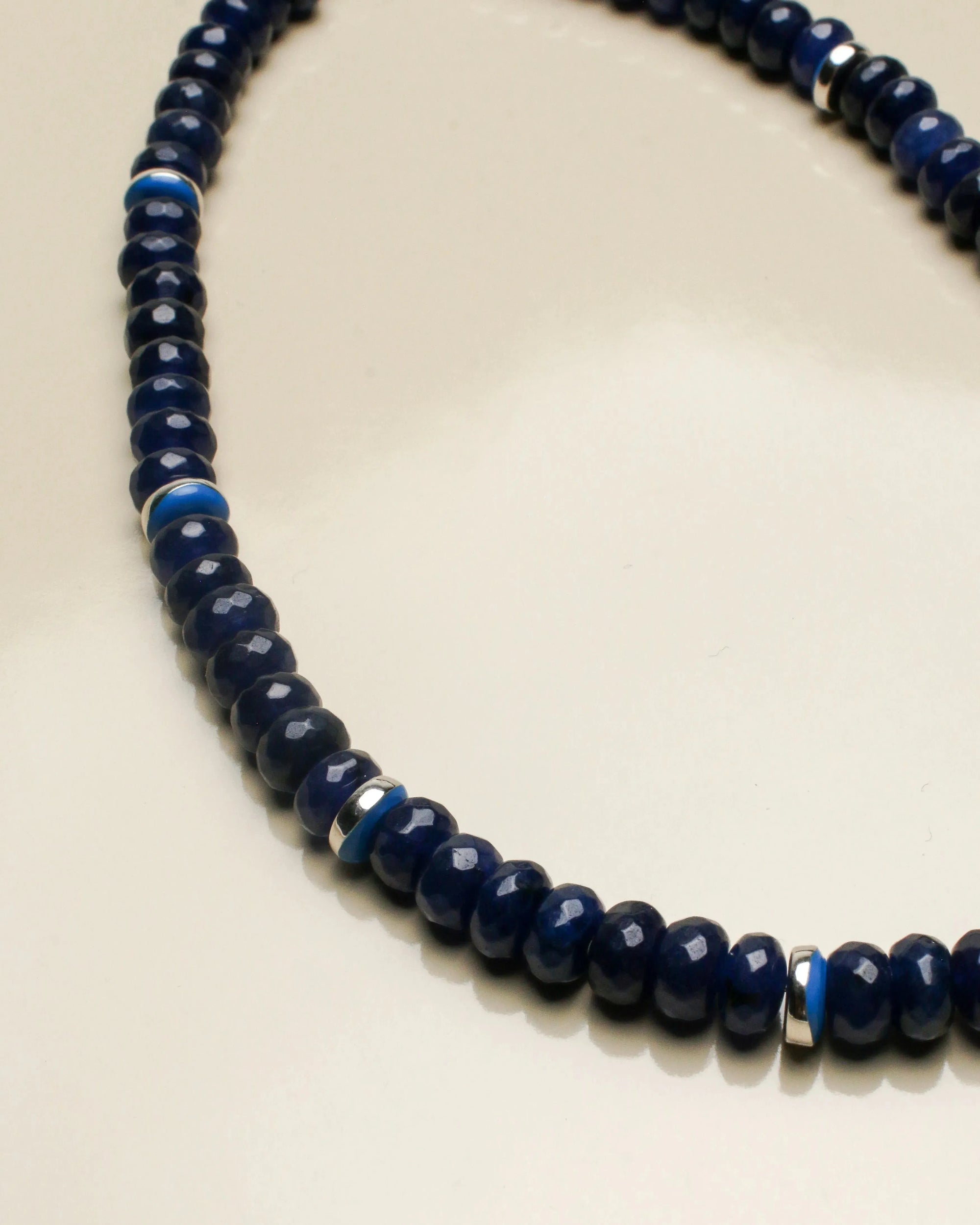 Close-up of the Lilou sapphire quartz necklace, highlighting the striking dark blue beads with subtle silver detailing, exuding a luxurious and sophisticated look.