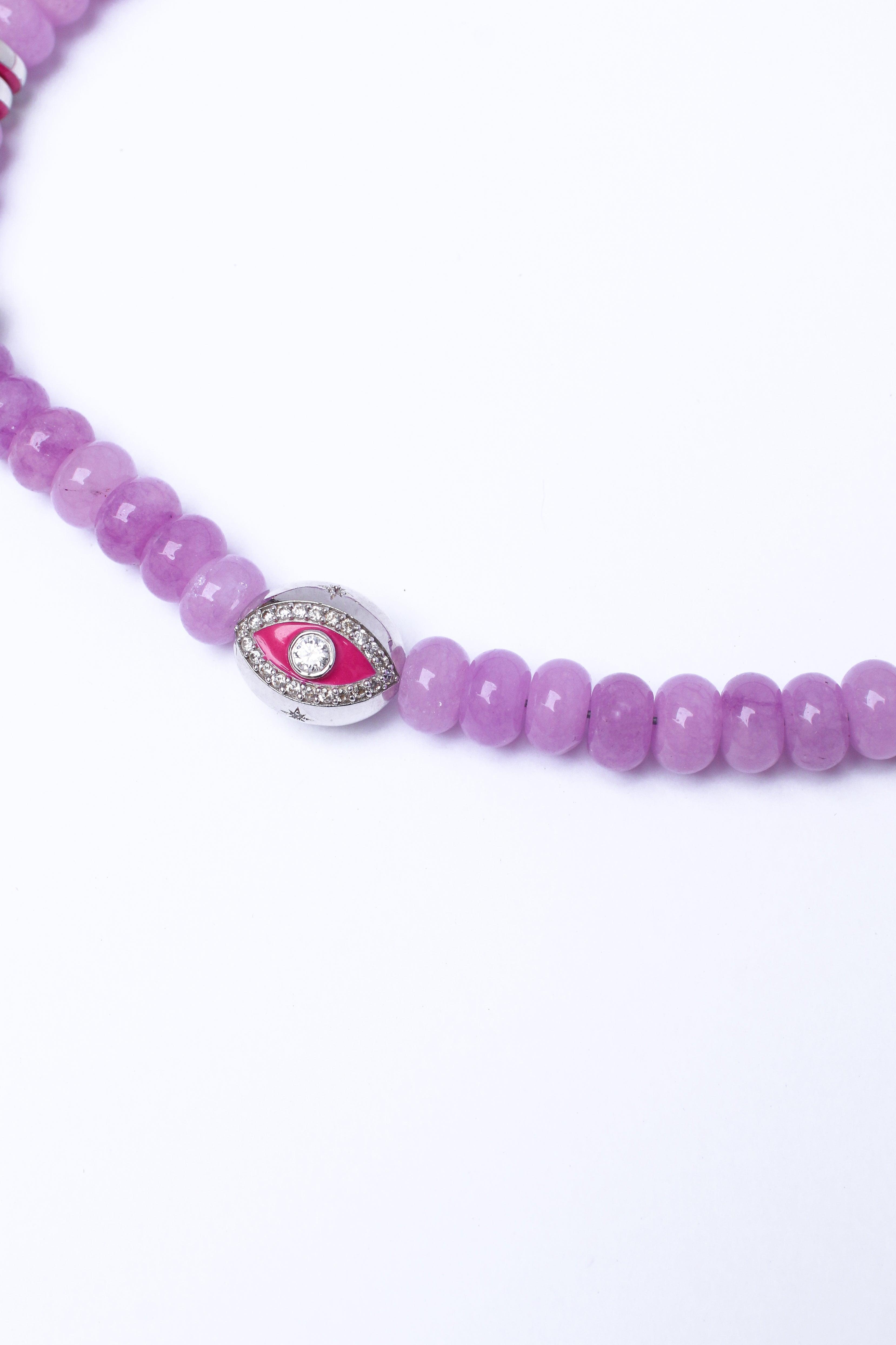 Lavender beaded phone strap, featuring a silver evil eye accent charm, on a white background