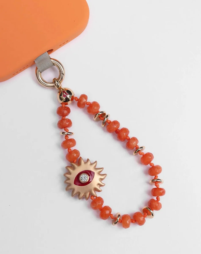 Clementine Quartz Mini India phone charm with Evil Eye Sun Charm and 14k Gold-Plated Hardware – Flat Lay on White Background