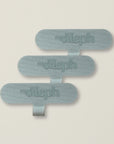 A set of three gray MyAleph wristlet cards, offering a universal fit for easy phone wristlet attachment.