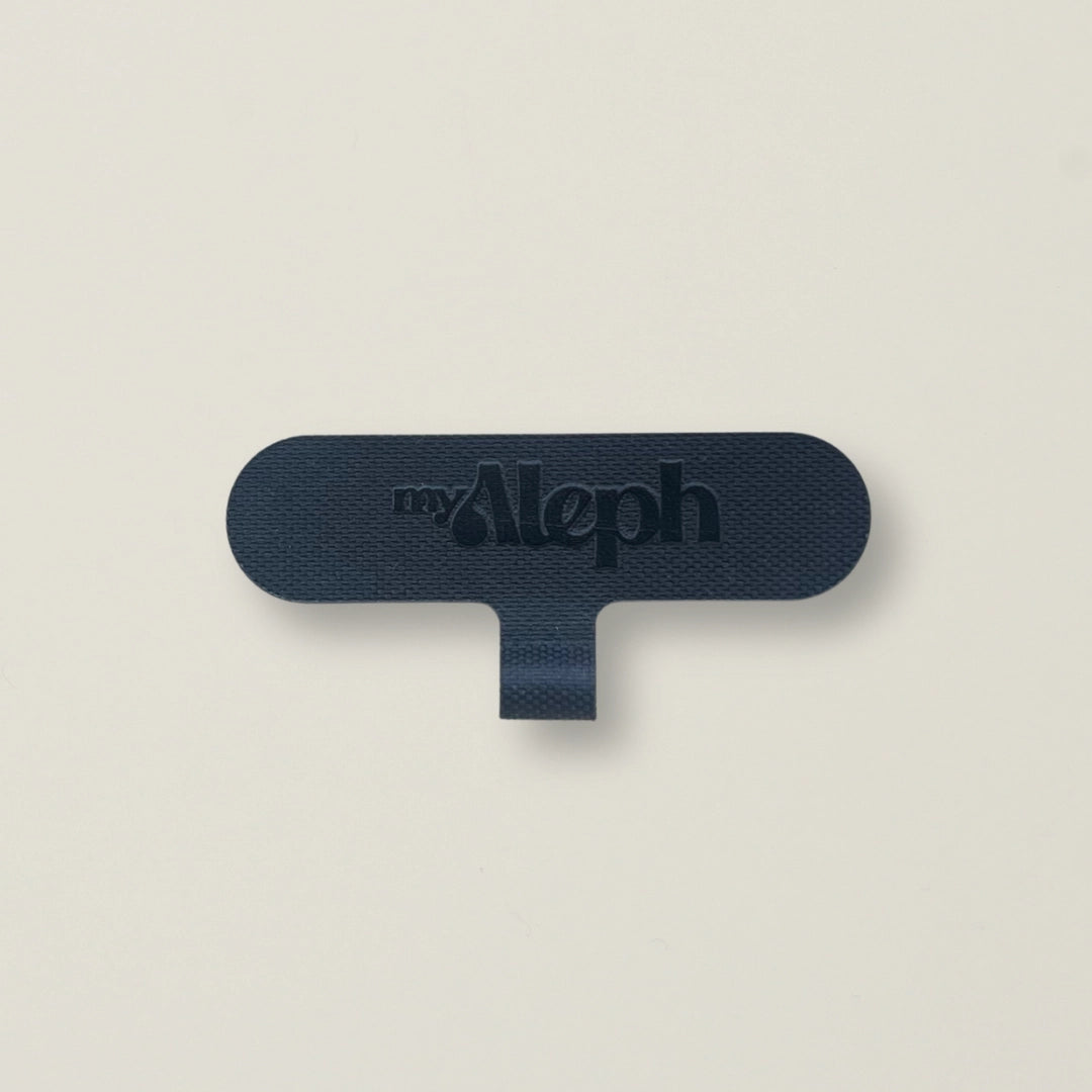 A single black MyAleph wristlet card against a neutral background, showing its compact and durable design.