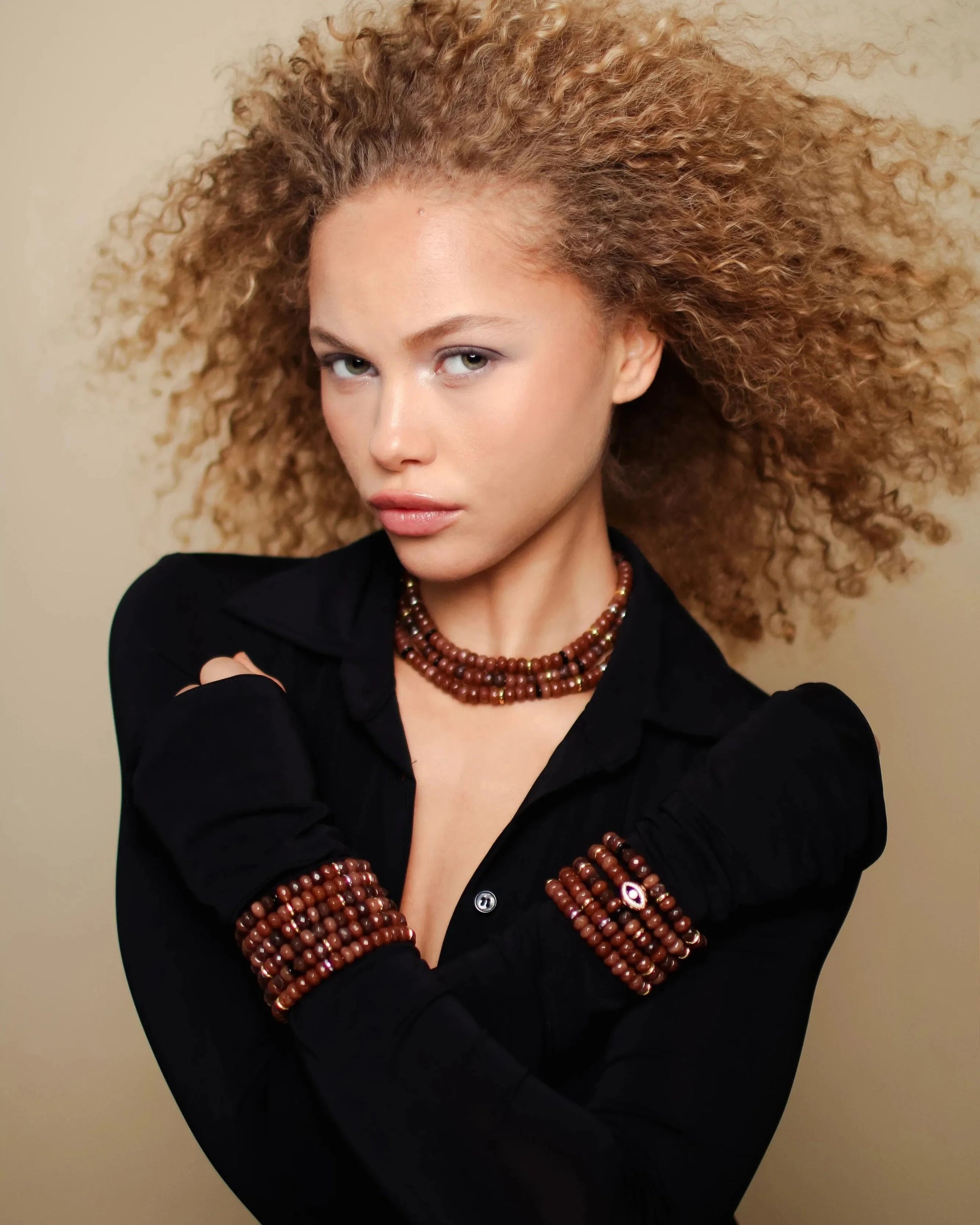 Model wearing the Valerie Necklace in Caramel, styled with matching bracelets for a bold, cohesive look.