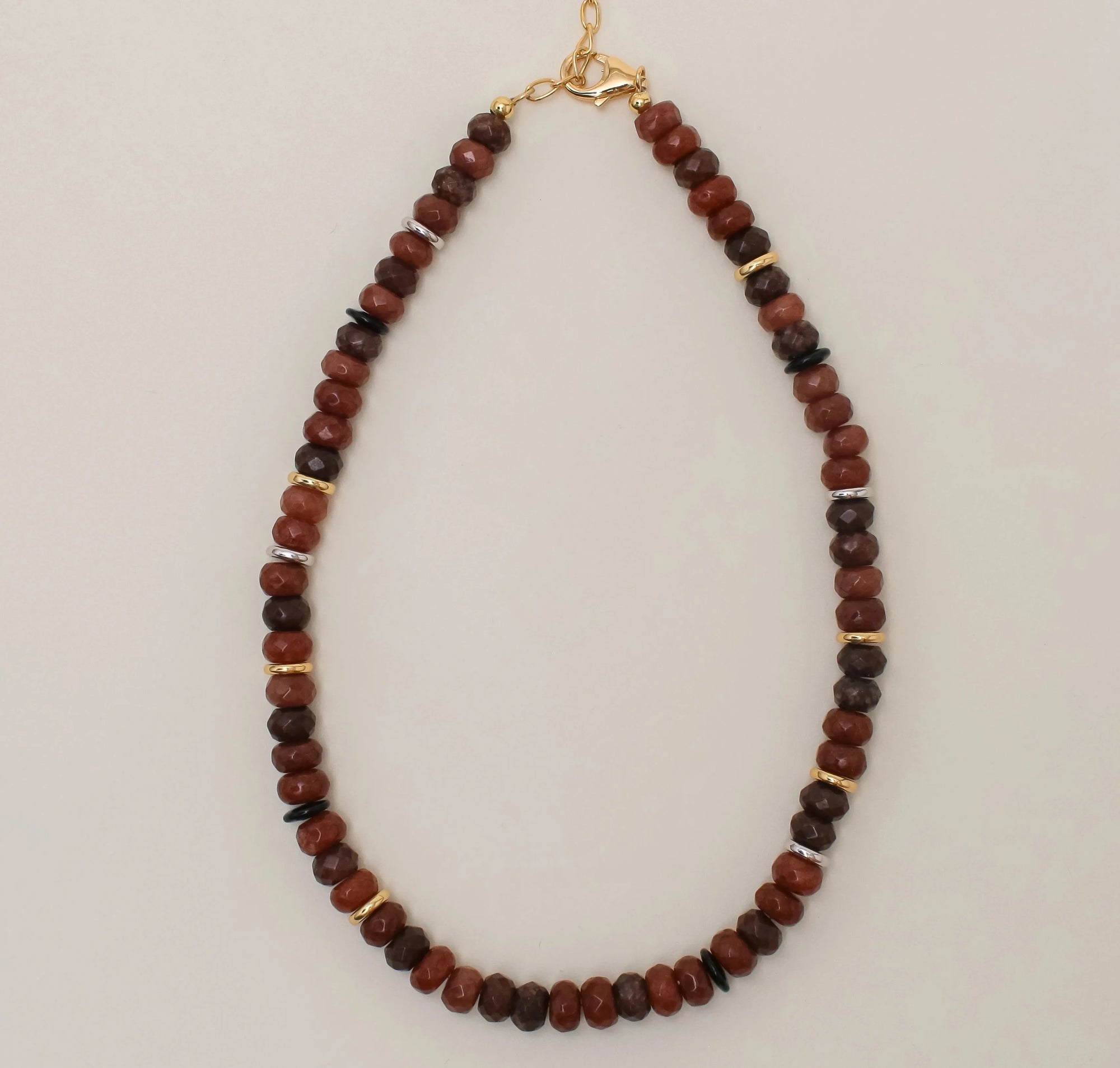 The Valerie Necklace in Espresso, featuring rich multi-toned brown quartz beads with 14k gold-plated dividers and an adjustable gold chain, displayed against a neutral background.