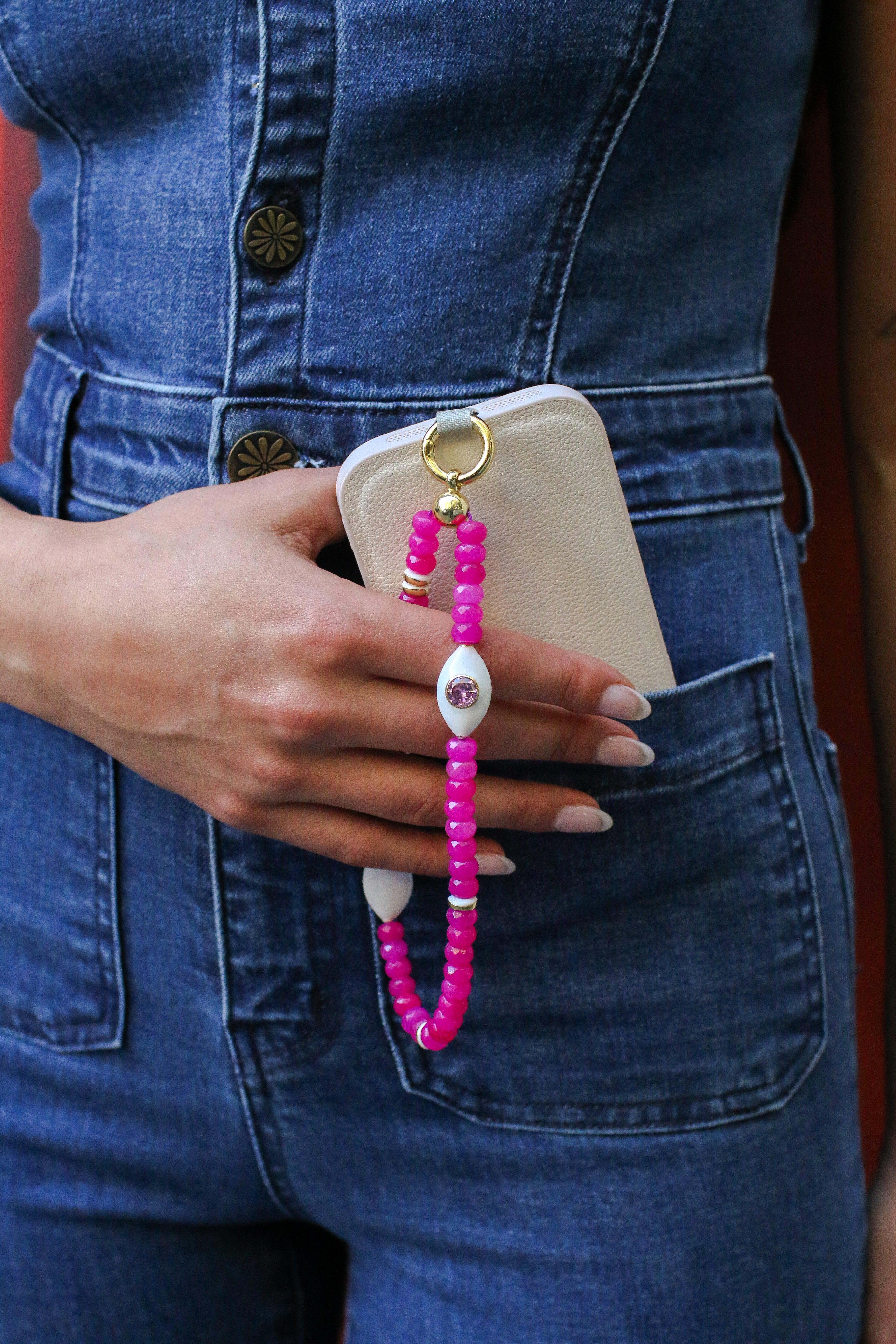 mano wristlet passionate pink cell phone strap in use