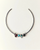 Silver necklace with colored beads on a light beige background